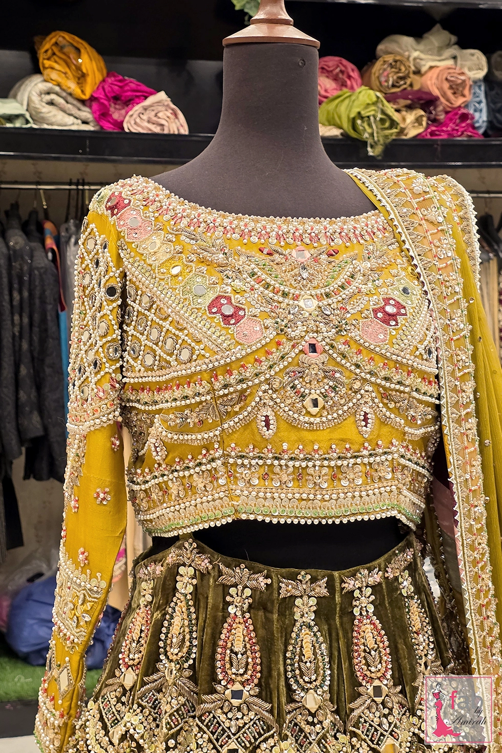 Close up view of mustard yellow blouse embellishment and pearl details