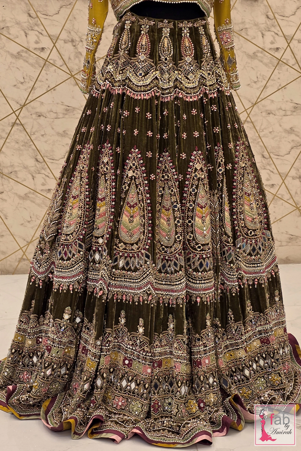 Mid section view of paisley embroidery details on velvet skirt