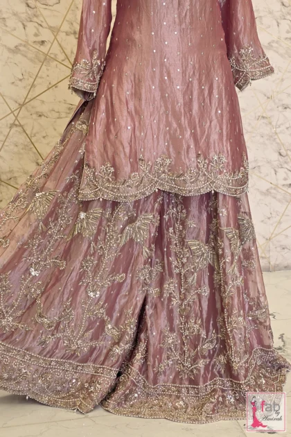 FAB By AMIRAH 5 Close up view of hand embellished scalloped shirt hemline and sharara flare.