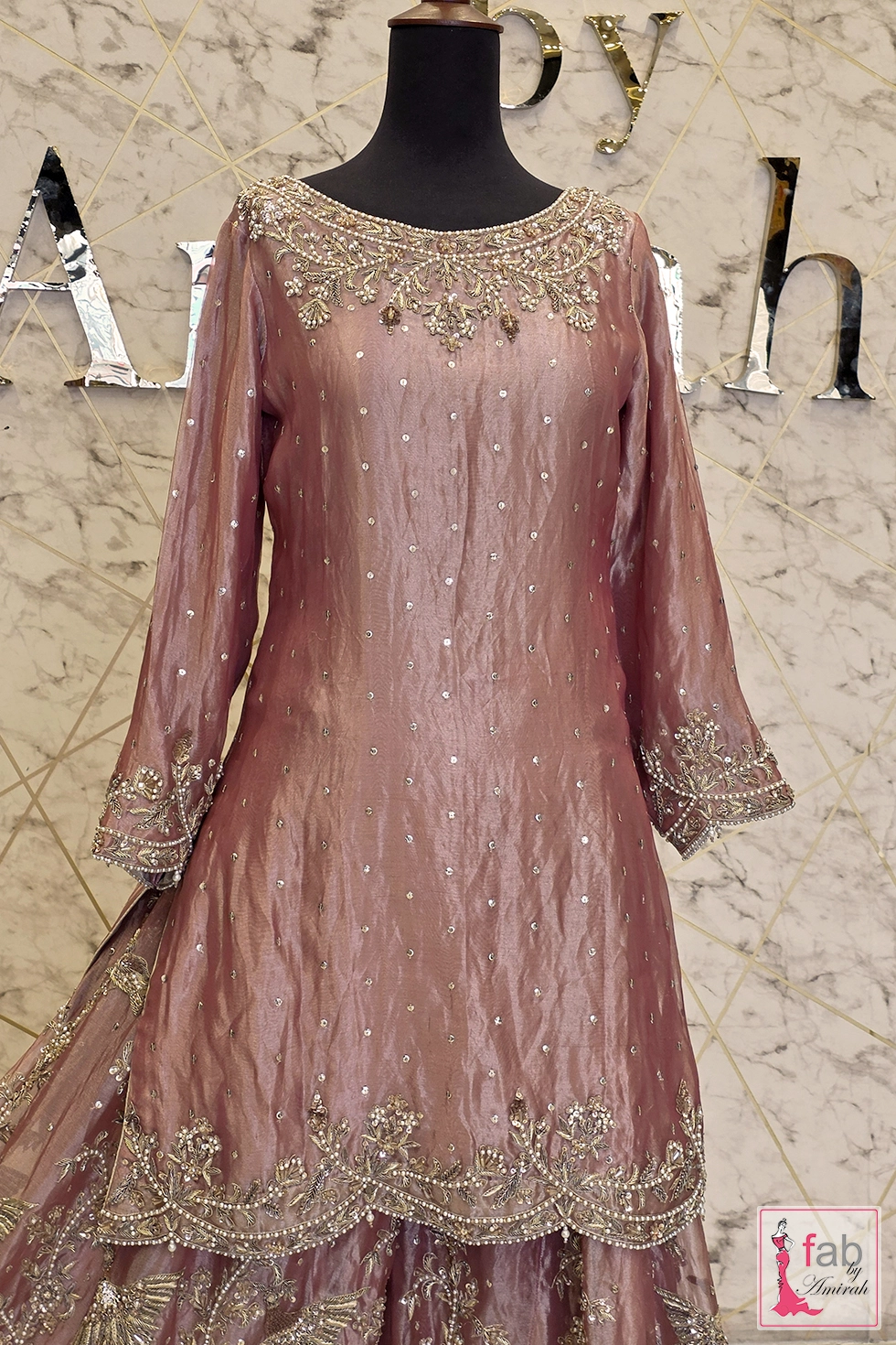 Detailed shot of boat neckline zardozi embroidery and full length sleeves