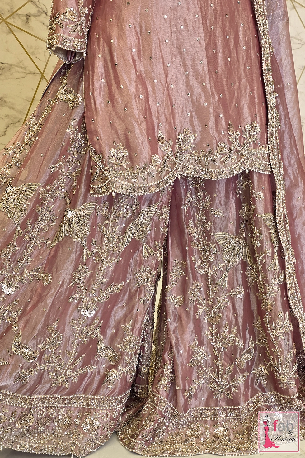 Close up of hand stitched zardozi and sequin motifs on the lower shirt and pants.