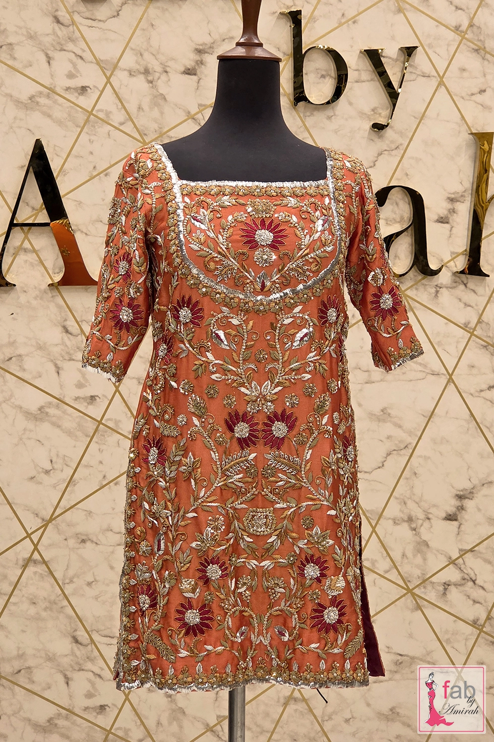 Front view mannequin display of hand embroidered rust bridal shirt Front view mannequin display of hand embroidered rust bridal shirt
