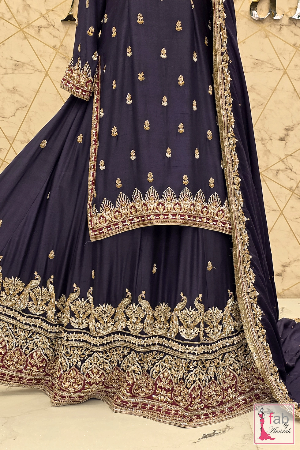 Side angle detail of the purple silk kurti and peacock lehenga skirt