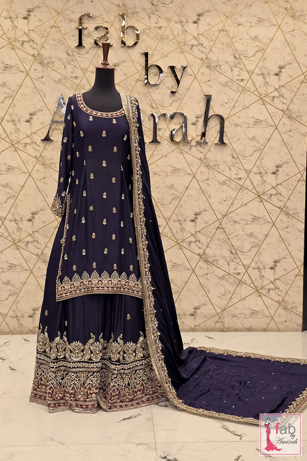 Full view of the regal purple bridal lehenga with intricate gold embroidery