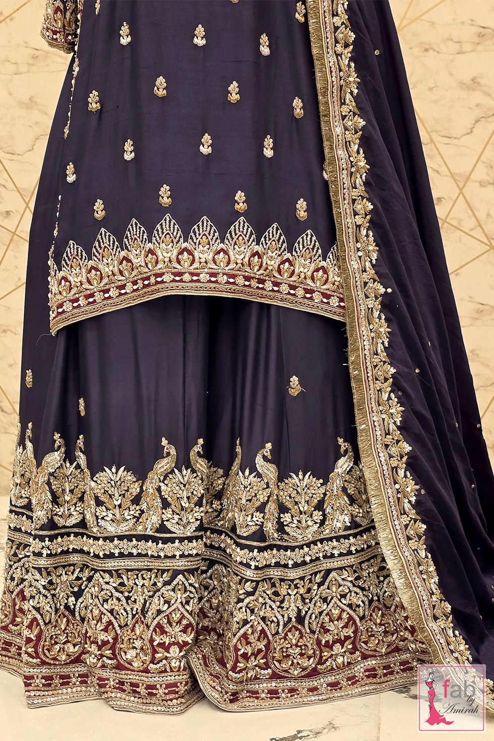 Detailed view of the embroidered kurti hem and lehenga flare