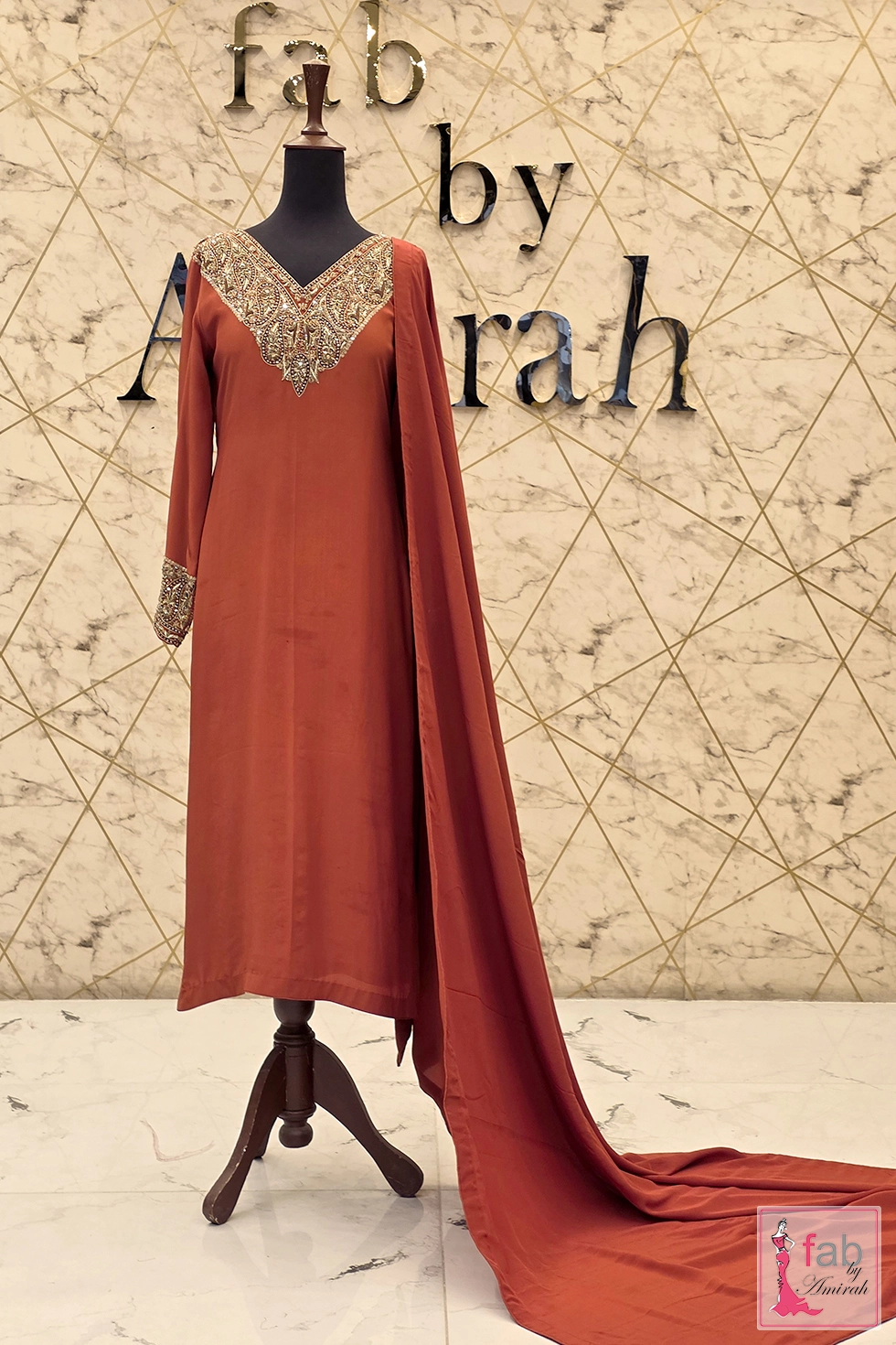 Rust party wear suit with hand embroidered paisley V neck and dupatta
