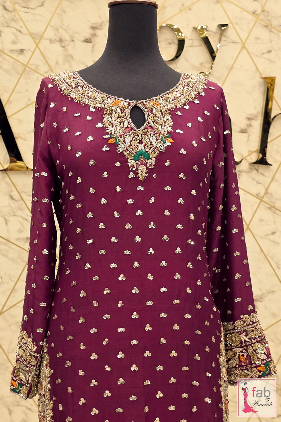 Close up view of keyhole neckline with intricate zardozi and sequin embroidery