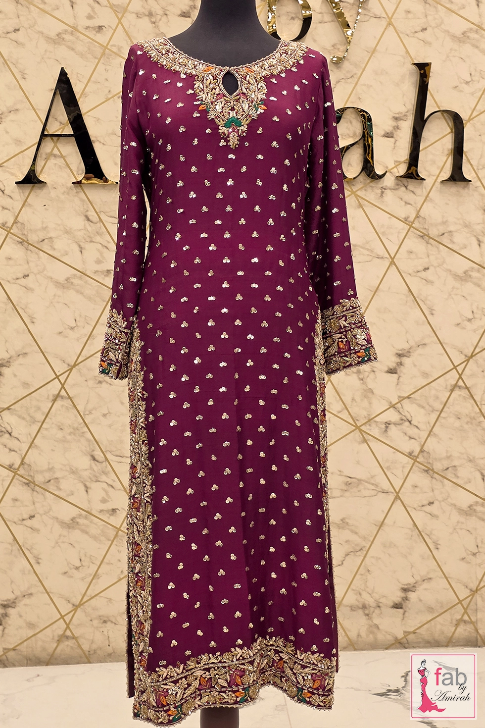 Full length magenta party wear suit with hand embroidered gold zardozi neckline and border details