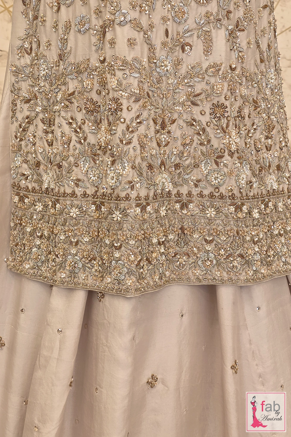 Close up view of intricate metallic zardozi and sequin embroidery