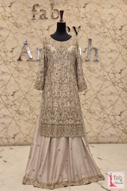 Champagne gold pakistani bridal gharara with trailing dupatta