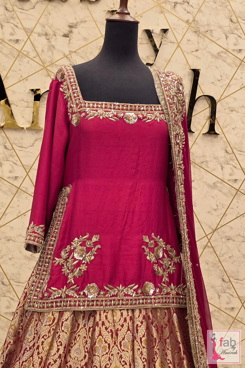 Close up of the embroidered square neckline and short shirt detail