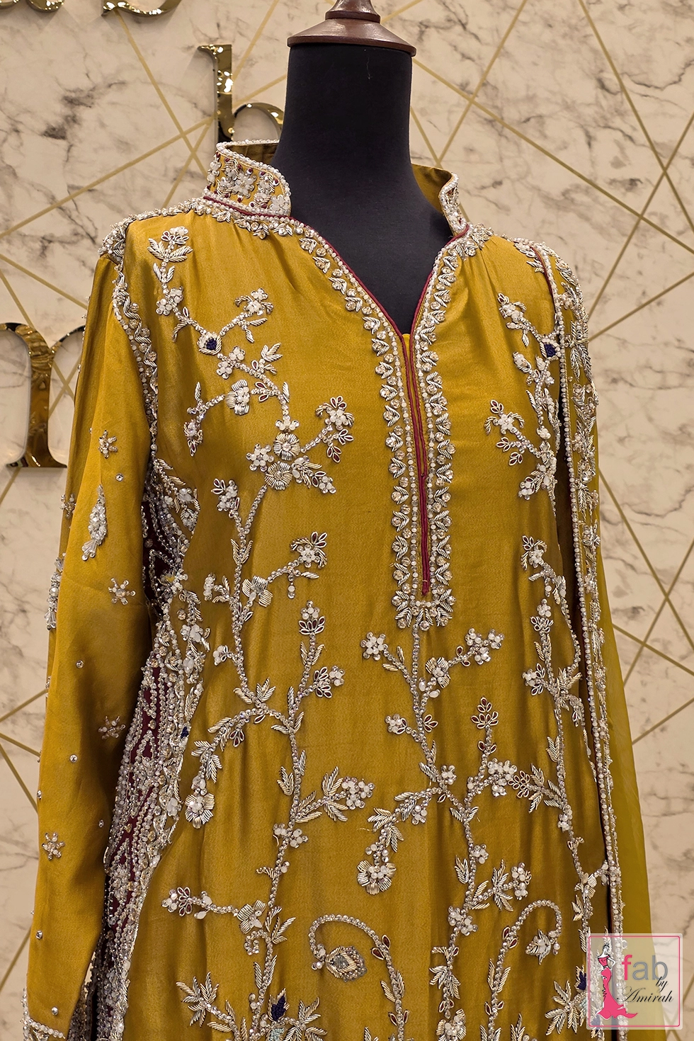 Close up view of detailed hand embroidery and zardozi embellishments Close up view of detailed hand embroidery and zardozi embellishments