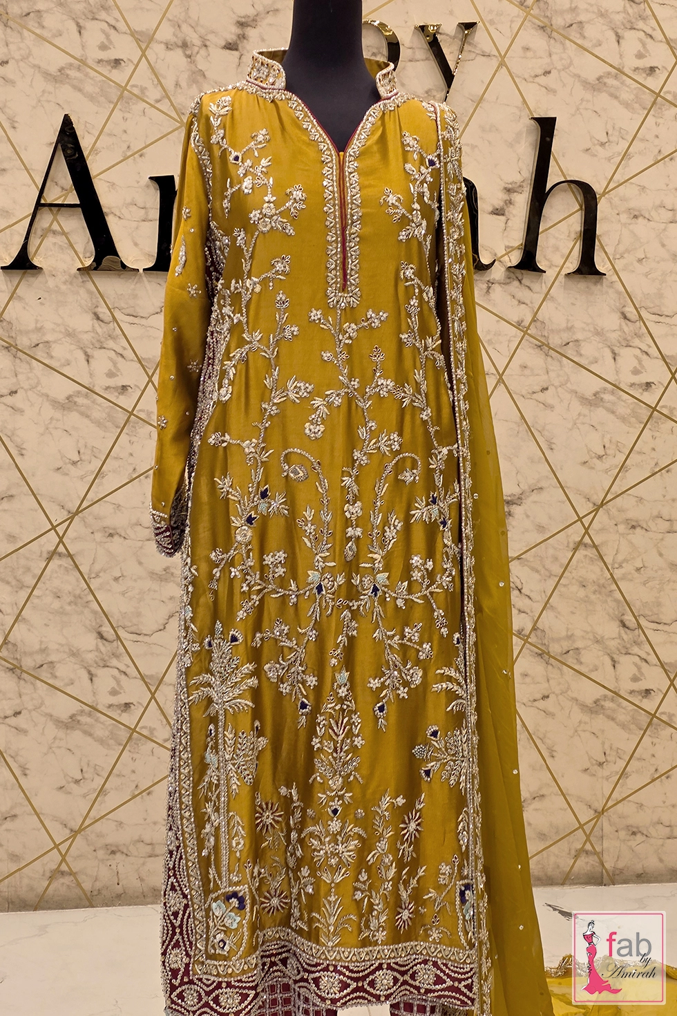 Full length front view of long yellow tunic and maroon sharara trousers Full length front view of long yellow tunic and maroon sharara trousers