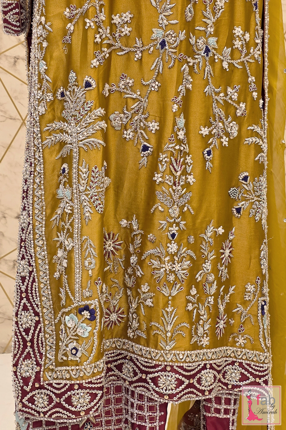 Close up of net dupatta border and heavily embellished lower sharara flare Close up of net dupatta border and heavily embellished lower sharara flare