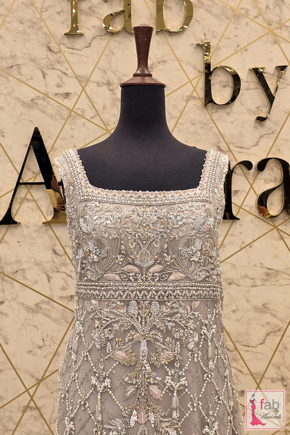 Close up of square neckline and embellished bodice