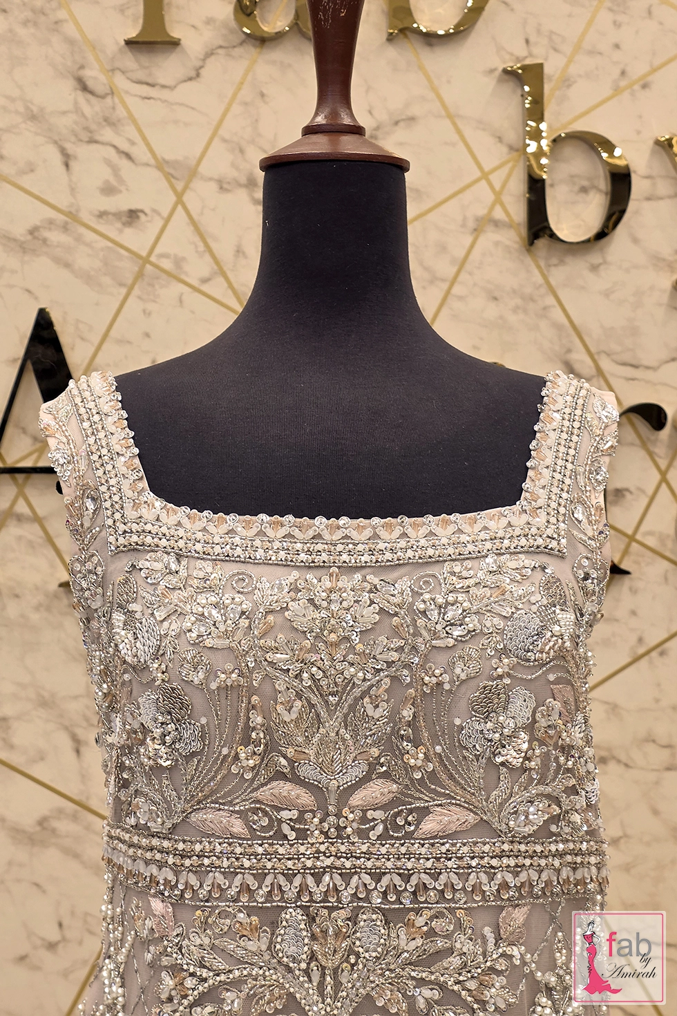Detailed close up of pearl and sequin embroidery on bodice