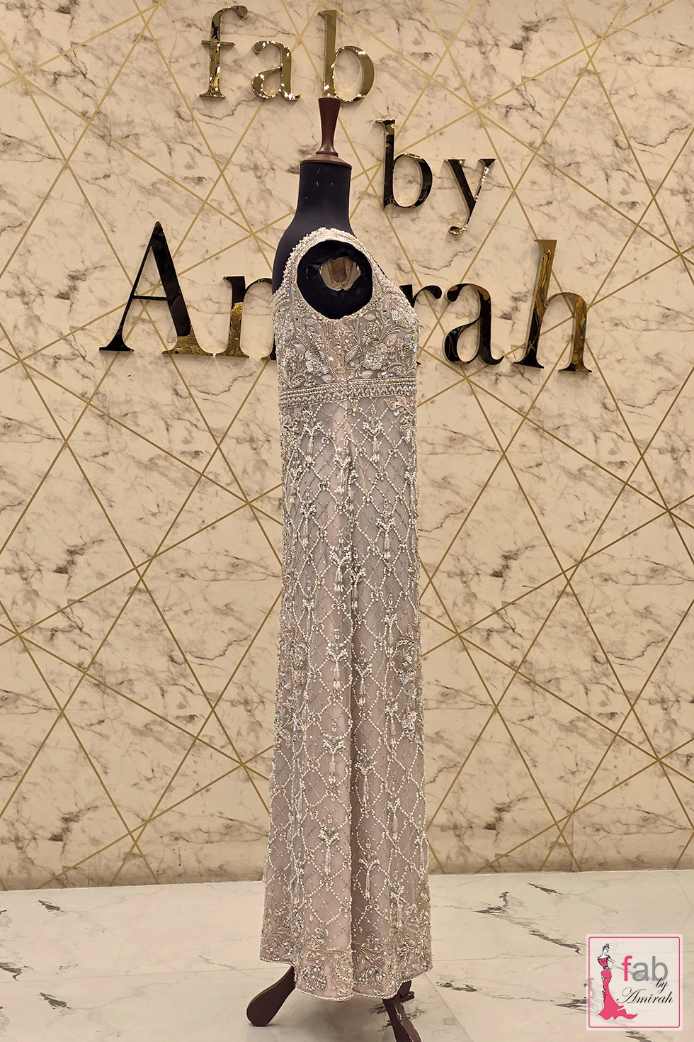 Back profile view of embroidered sleeveless formal gown