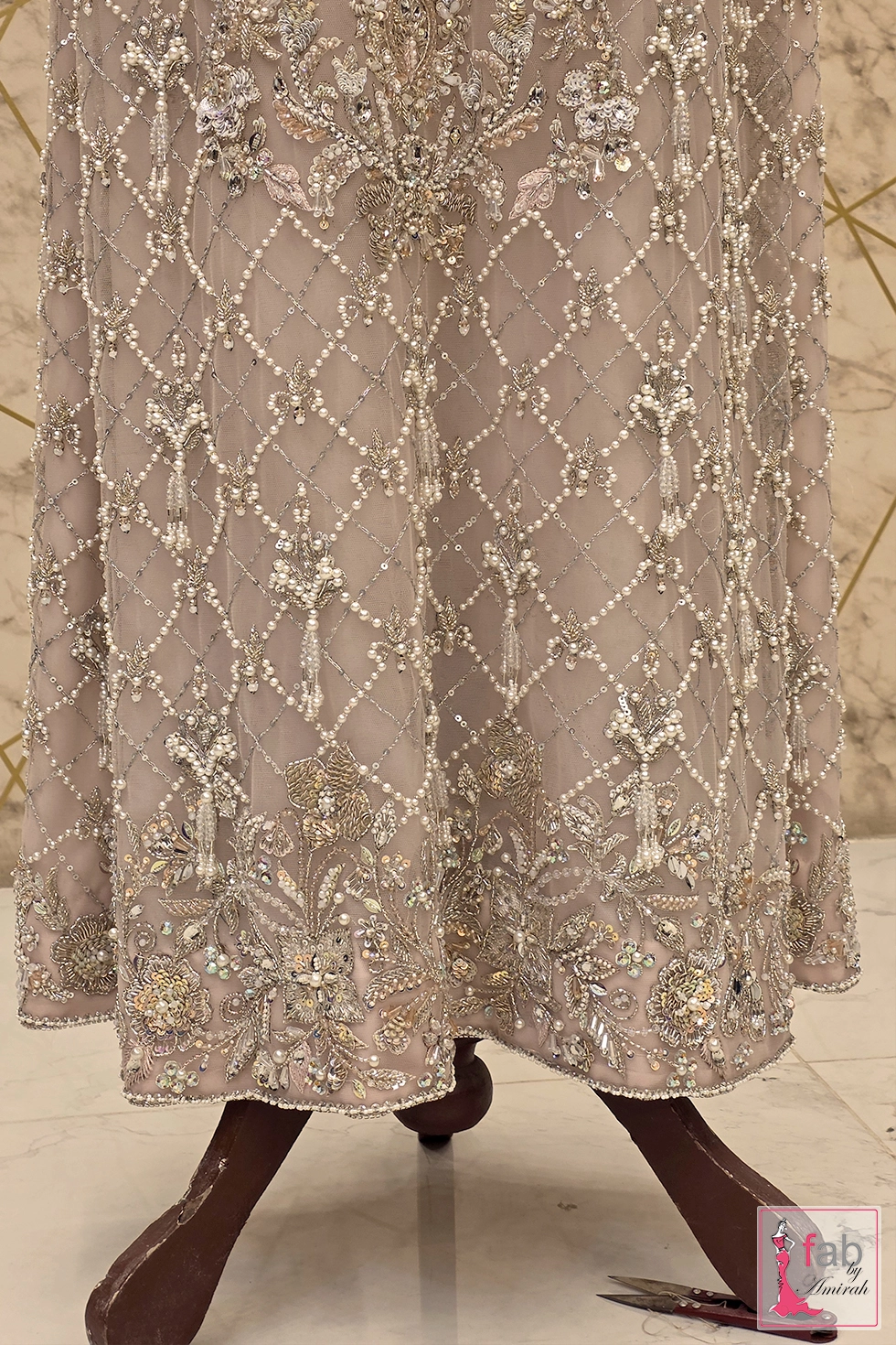 Lower skirt close up displaying lattice lattice handwork