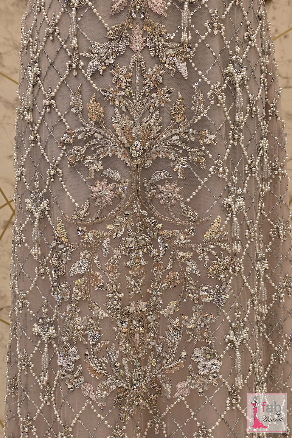 Pattern close up showing central floral embroidery motifs