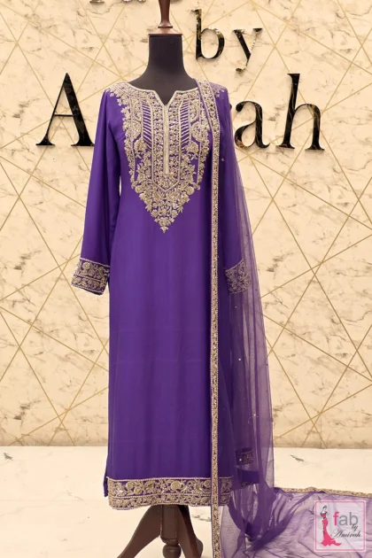 Full length front view of royal purple embroidered formal suit on display