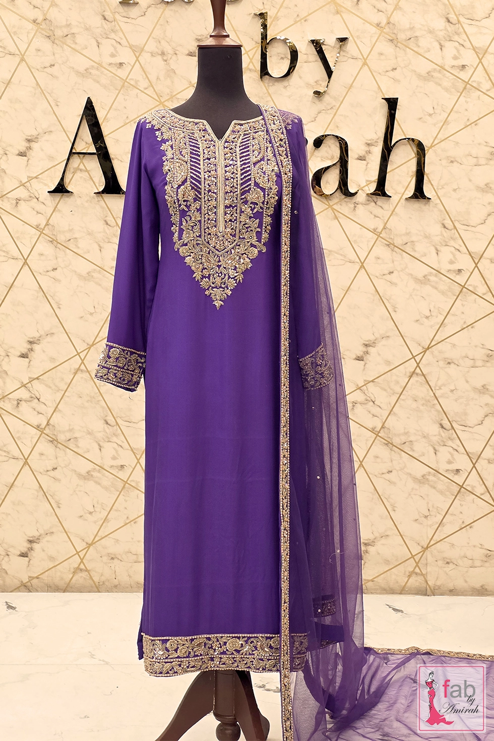 Full length front view of royal purple embroidered formal suit on display Full length front view of royal purple embroidered formal suit on display