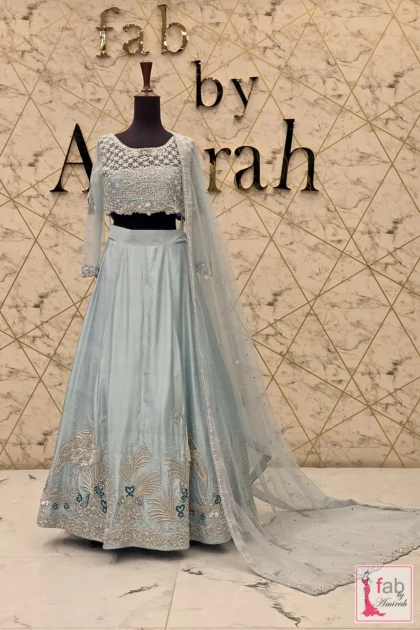 Ice blue bridal lehenga with full flared skirt choli top and sheer draped dupatta