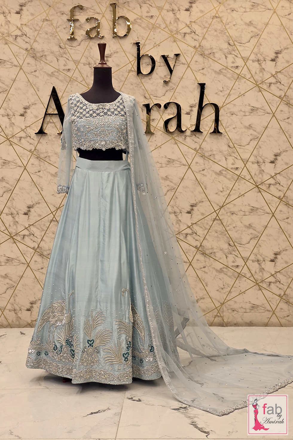 Ice blue bridal lehenga with full flared skirt choli top and sheer draped dupatta