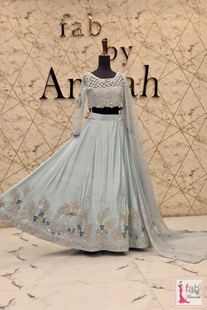 Wide angle display showing the full flare and spread of the ice blue lehenga skirt