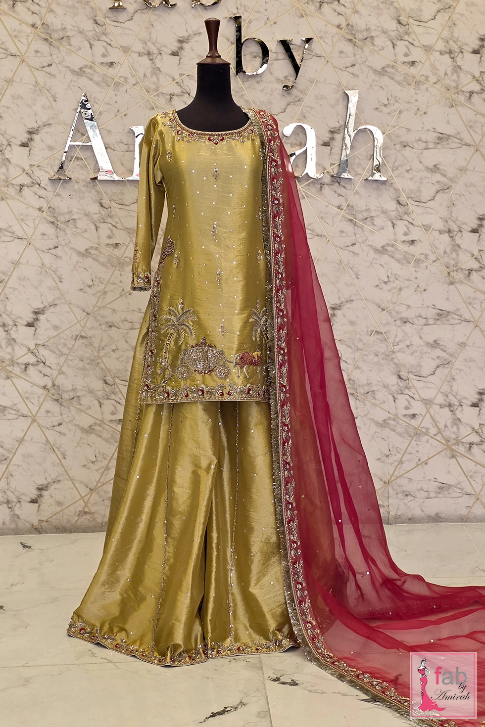 Front full length view of golden olive sharara suit with detailed hemline motif