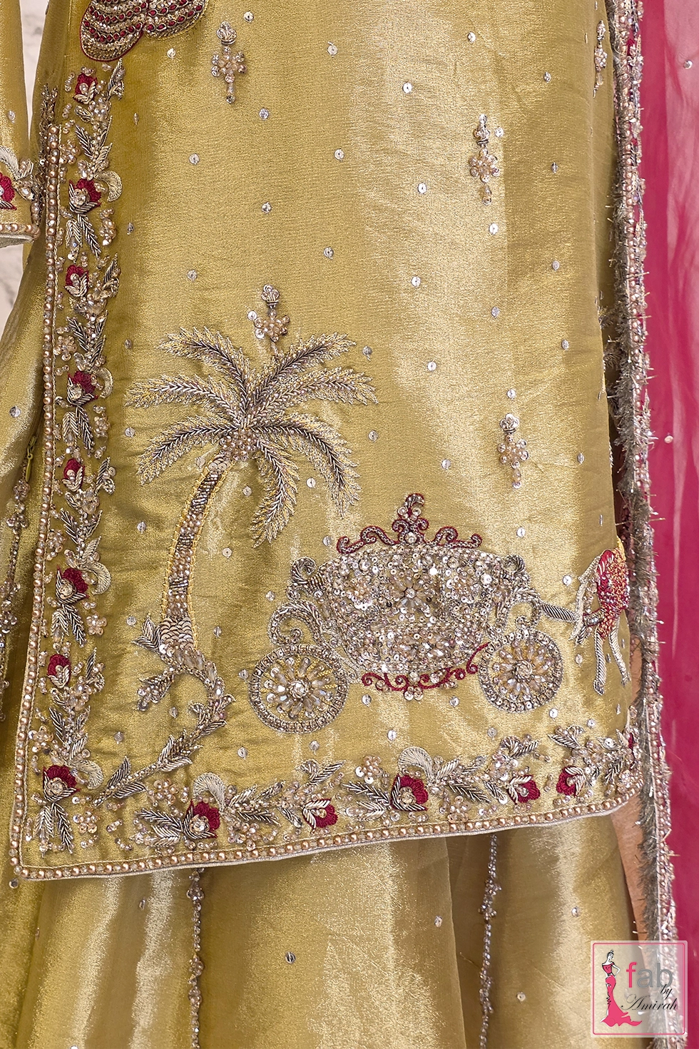 Close up of hand stitched palm tree and carriage zardozi work