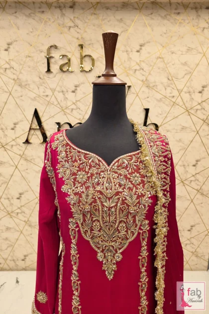 Close up detail of intricate hand zardozi stitching on sweetheart neckline.