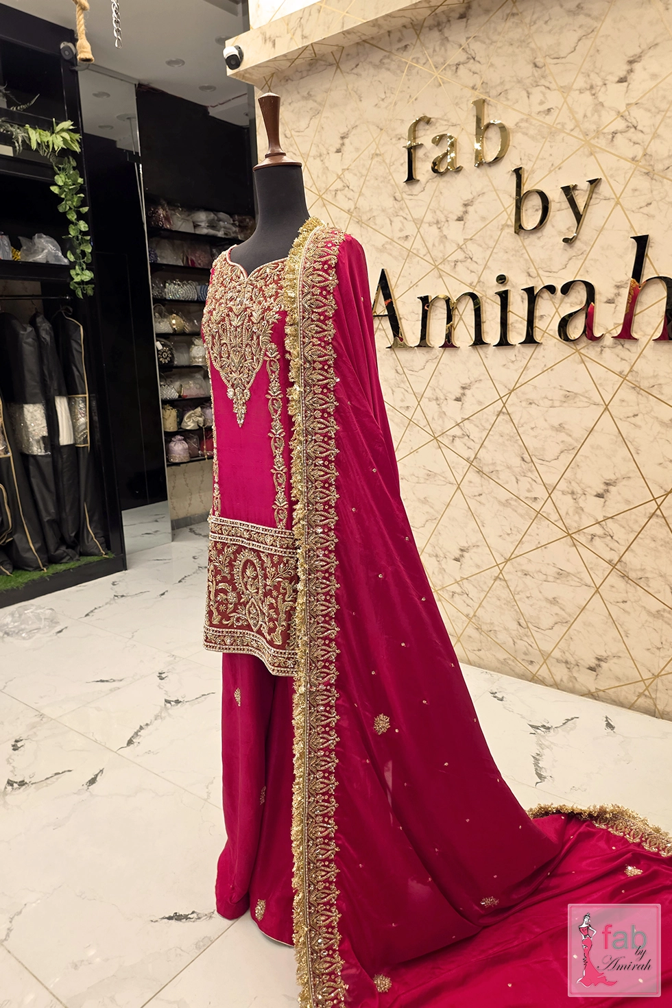 Side profile view of the magenta bridal ensemble on display mannequin.