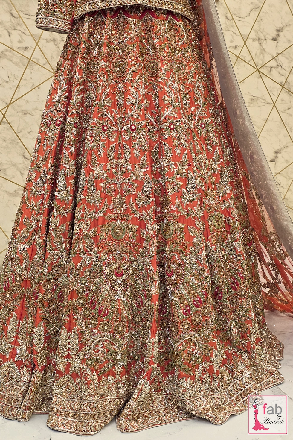 Detail shot of lehenga skirt panels and intricate hemline border