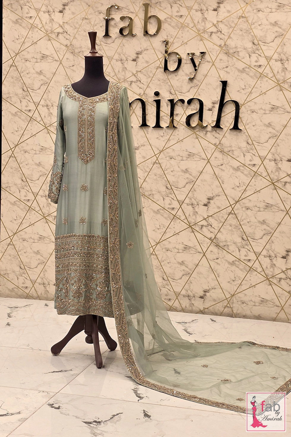 Full suit display featuring trailing sheer dupatta with embroidered borders