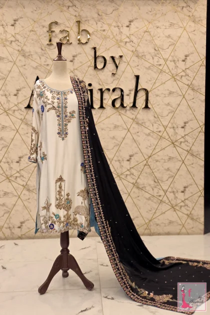 Off white embroidered suit with front architectural motif and black dupatta
