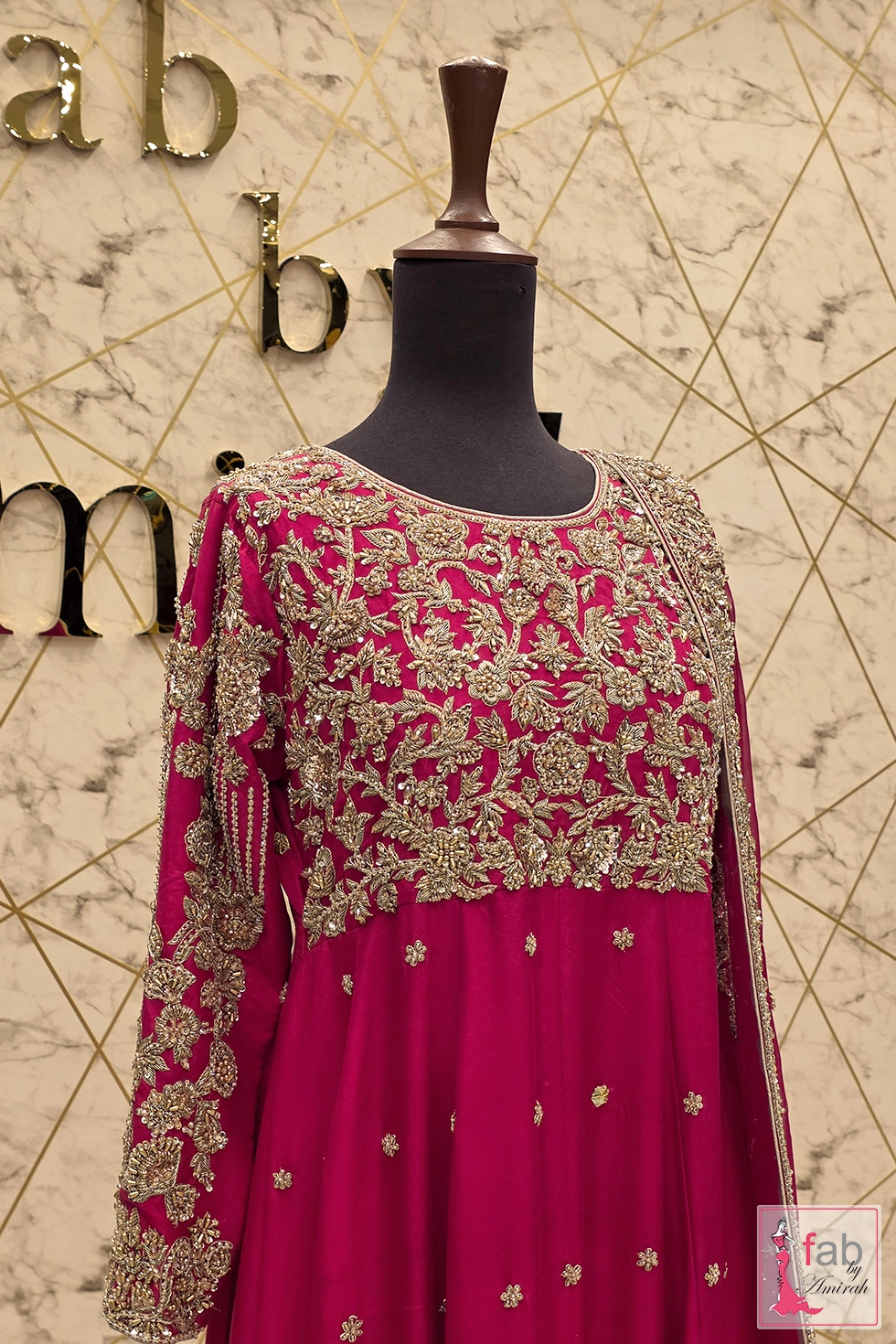Detailed view of dense gold thread work and bead details on bodice and sleeves Detailed view of dense gold thread work and bead details on bodice and sleeves