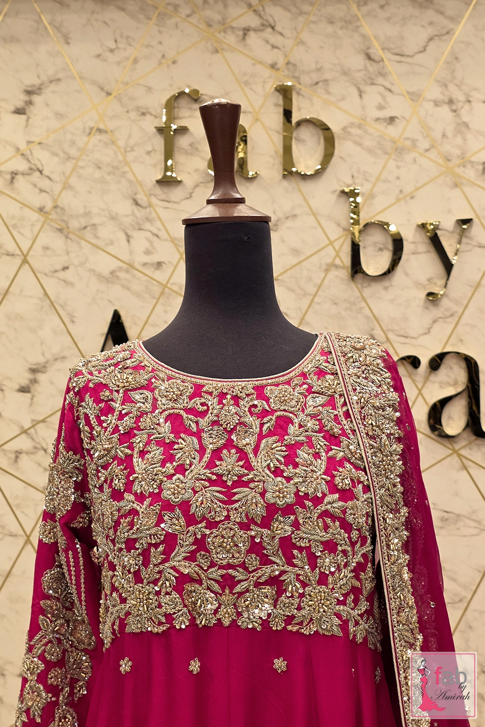 Close up detail shot of intricate gold embroidery work on bodice Close up detail shot of intricate gold embroidery work on bodice