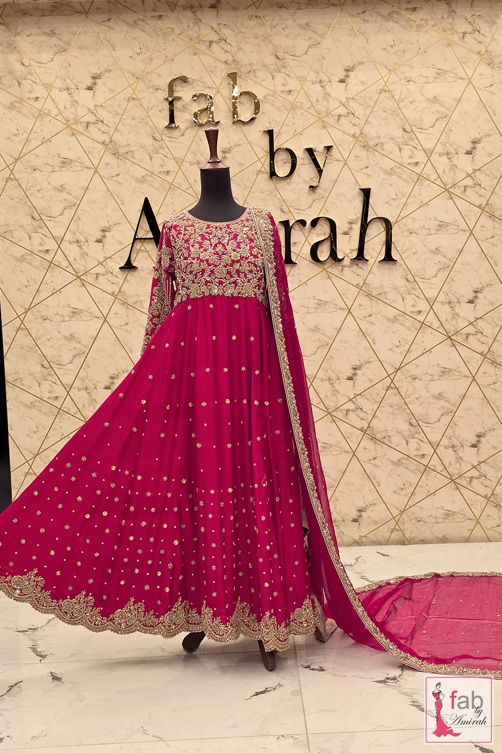 Full length side angle of flared magenta gown with dupatta drape Full length side angle of flared magenta gown with dupatta drape