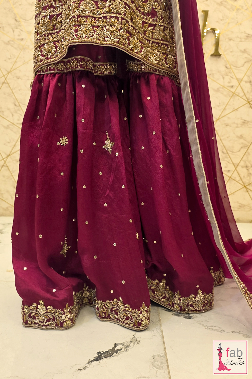 Close up of wide gharara flare showing knee seam and gathers
