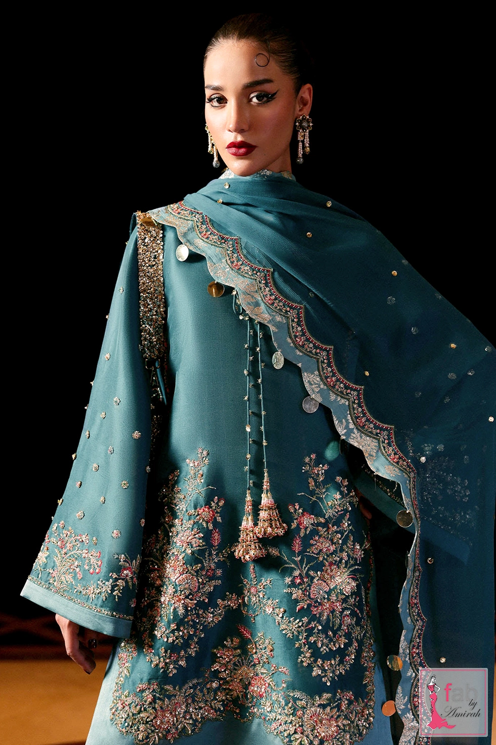 Side profile showing flared sleeve embroidery and draped scalloped dupatta Side profile showing flared sleeve embroidery and draped scalloped dupatta